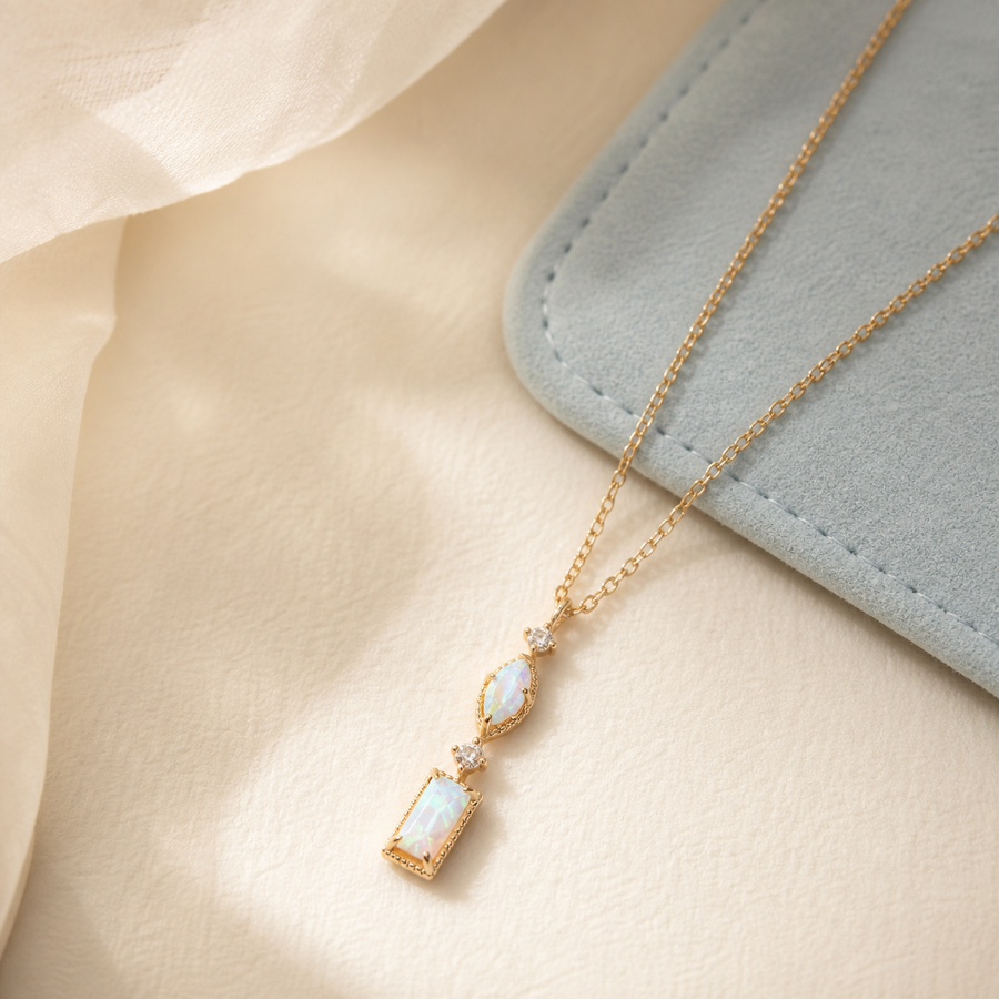 Opal line necklace displayed in a jewelry box