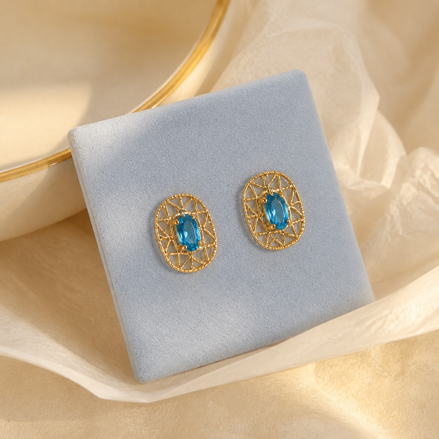 Azure lattice stud earrings in a soft velvet box